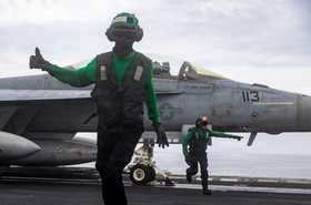 U.S. Sailors conduct final checks on an F/A-18F Super Hornet, attached to Strike Fighter Squadron (VFA) 41, as it prepares to launch from the flight deck of Nimitz-class aircraft carrier USS Abraham Lincoln (CVN 72), Operation Epic Fury, March 23, 2026